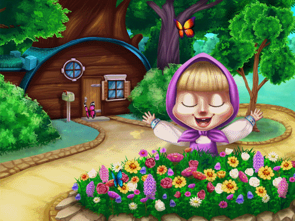 Маша сидит у клумбы с цветами